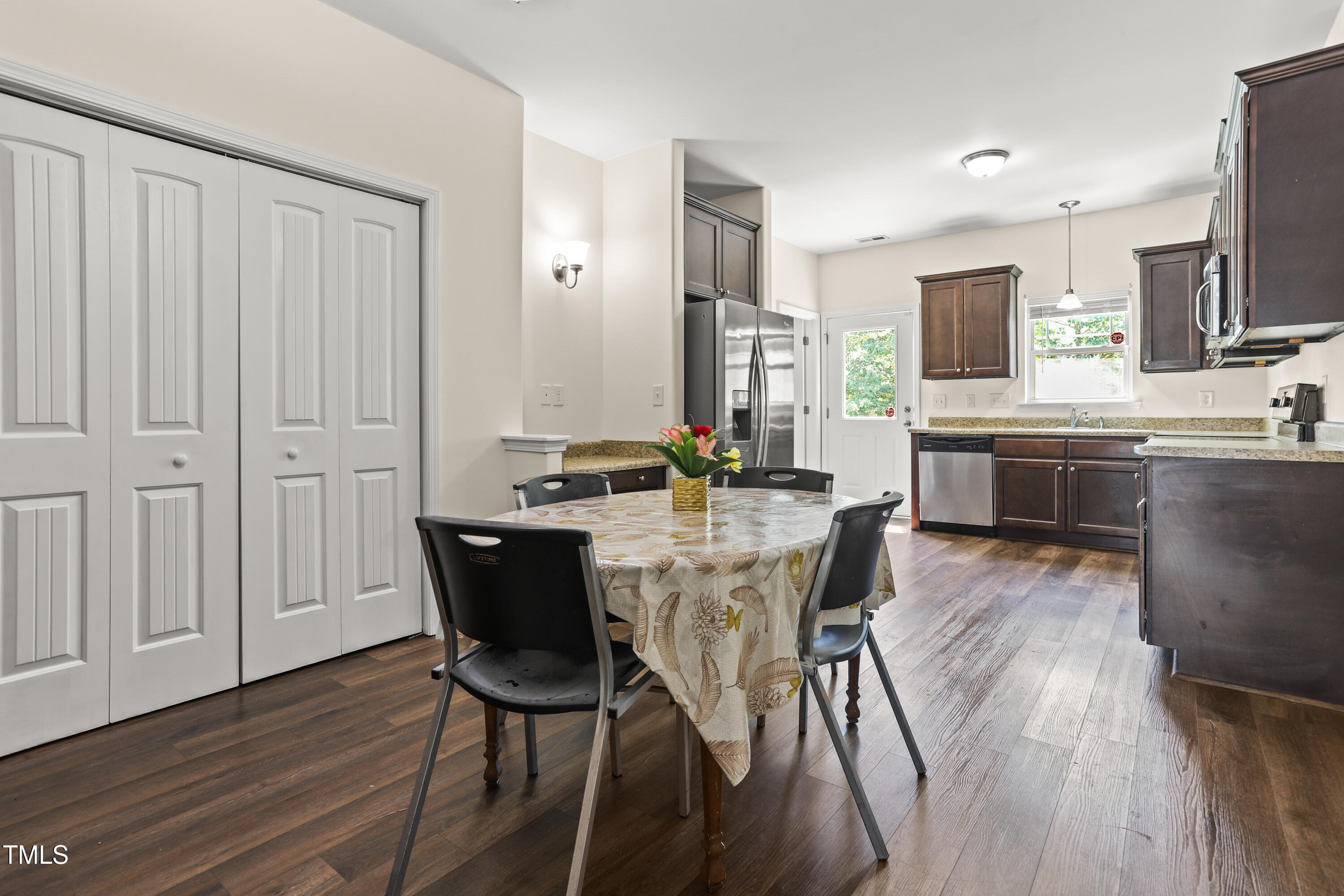 6420 Hatchies Drive Raleigh, NC 27610 - Photo 4 of 24 a view of a dining room with furniture and wooden floor