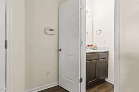 a bathroom with a sink and mirror