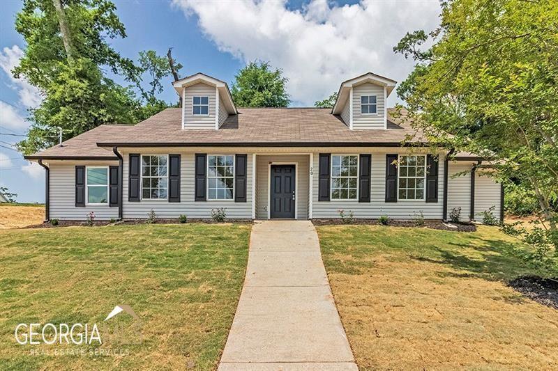 20 Smith Street Newnan, GA 30263 - Photo 1 of 1 a front view of a house with a garden
