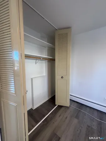 a bathroom with a shower a bath tub and a shower