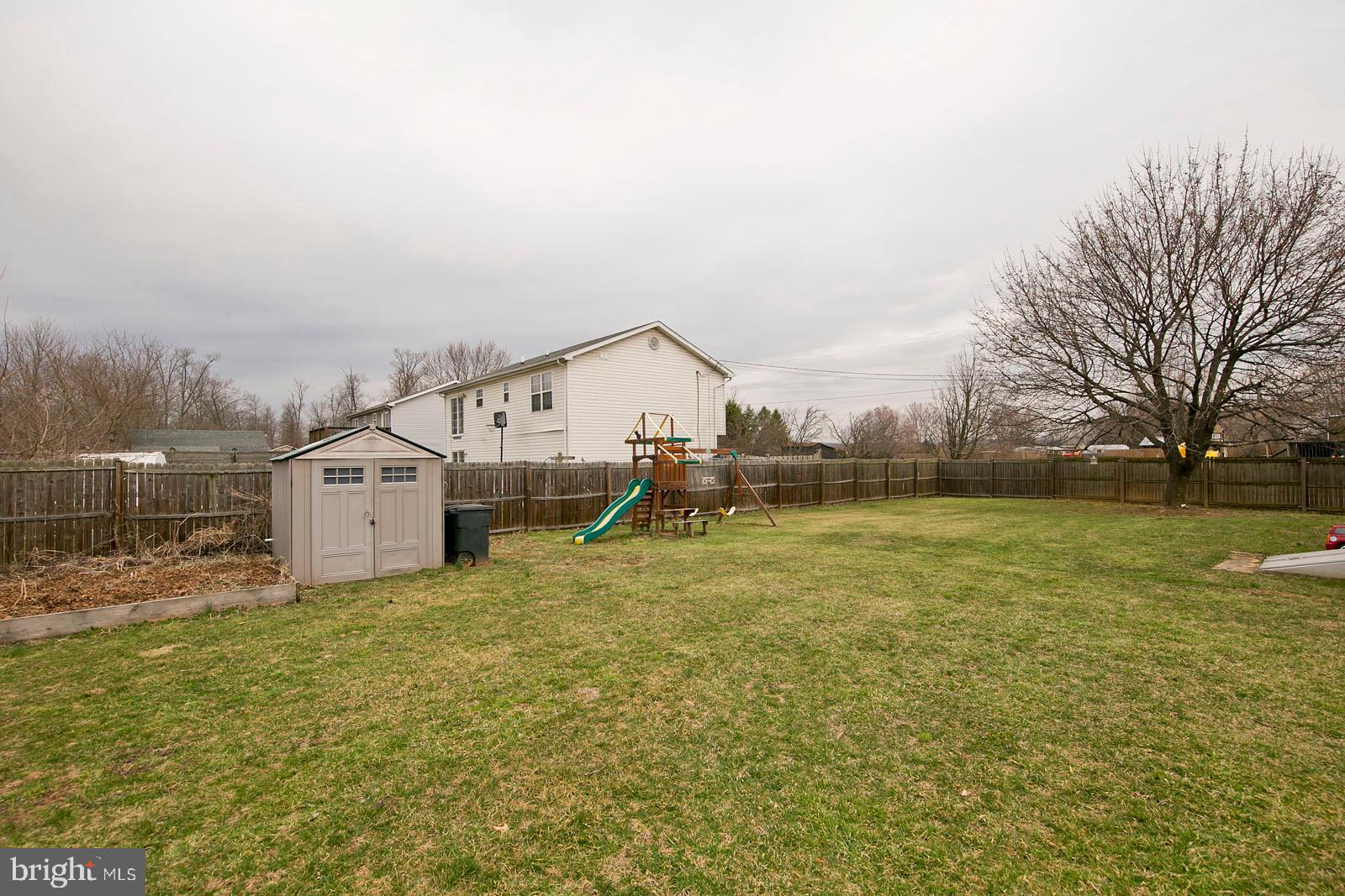 284 Fegan Road Bunker Hill, WV 25413 - Photo 33 of 35 Large fully fenced backyard
