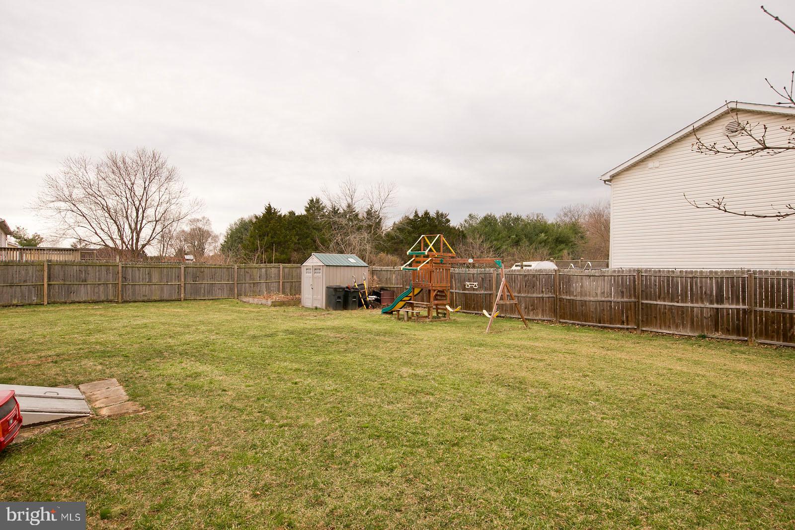 284 Fegan Road Bunker Hill, WV 25413 - Photo 35 of 35 Play set, storage shed and garden beds stay!