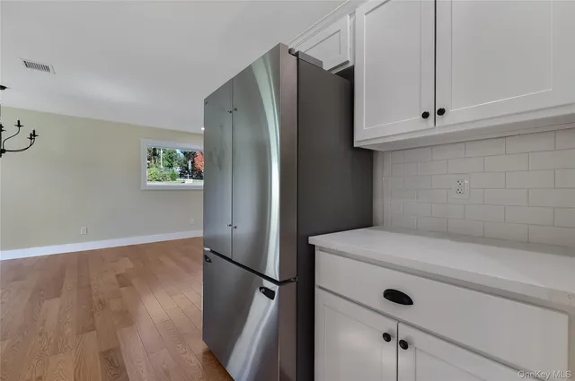 a view of kitchen with sink microwave and stove