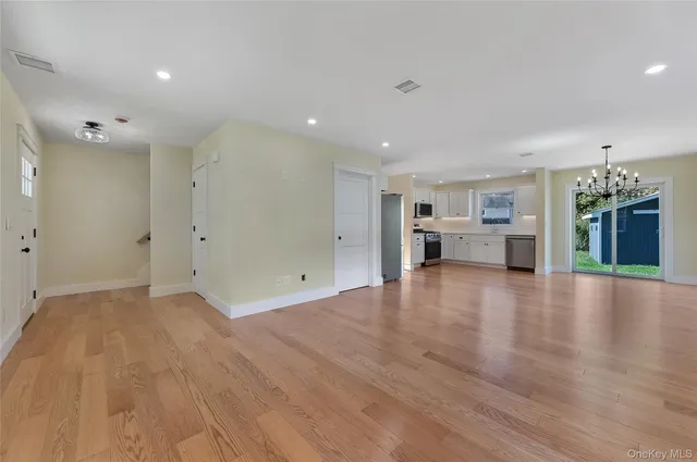 a kitchen with a refrigerator and a stove