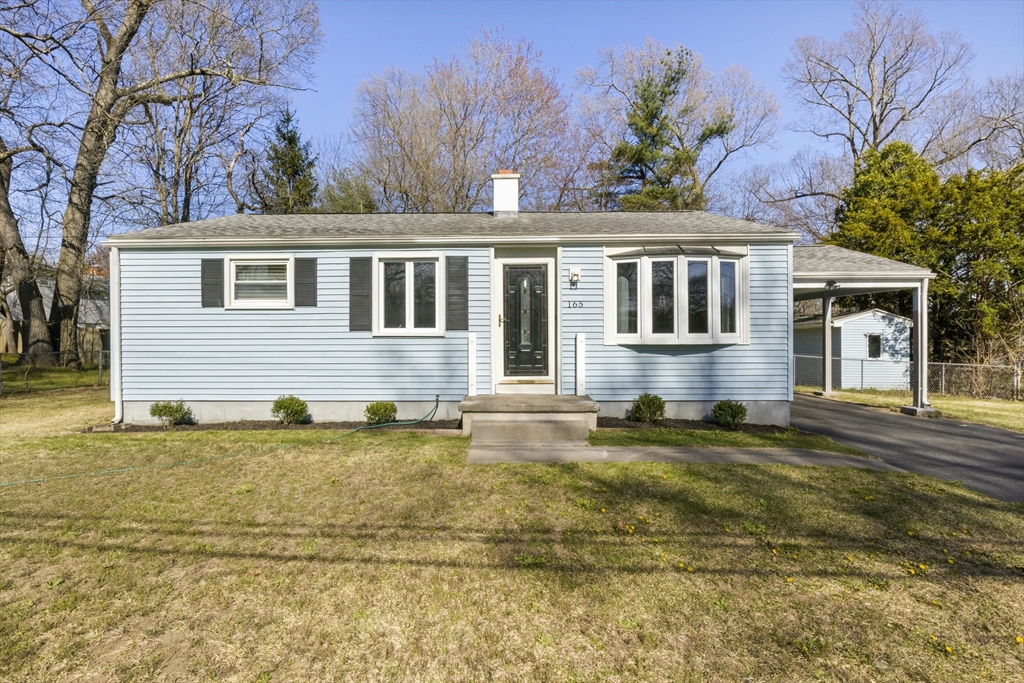 165 Sawmill Road Springfield, MA 01118 - Photo 1 of 39 a front view of a house with a garden
