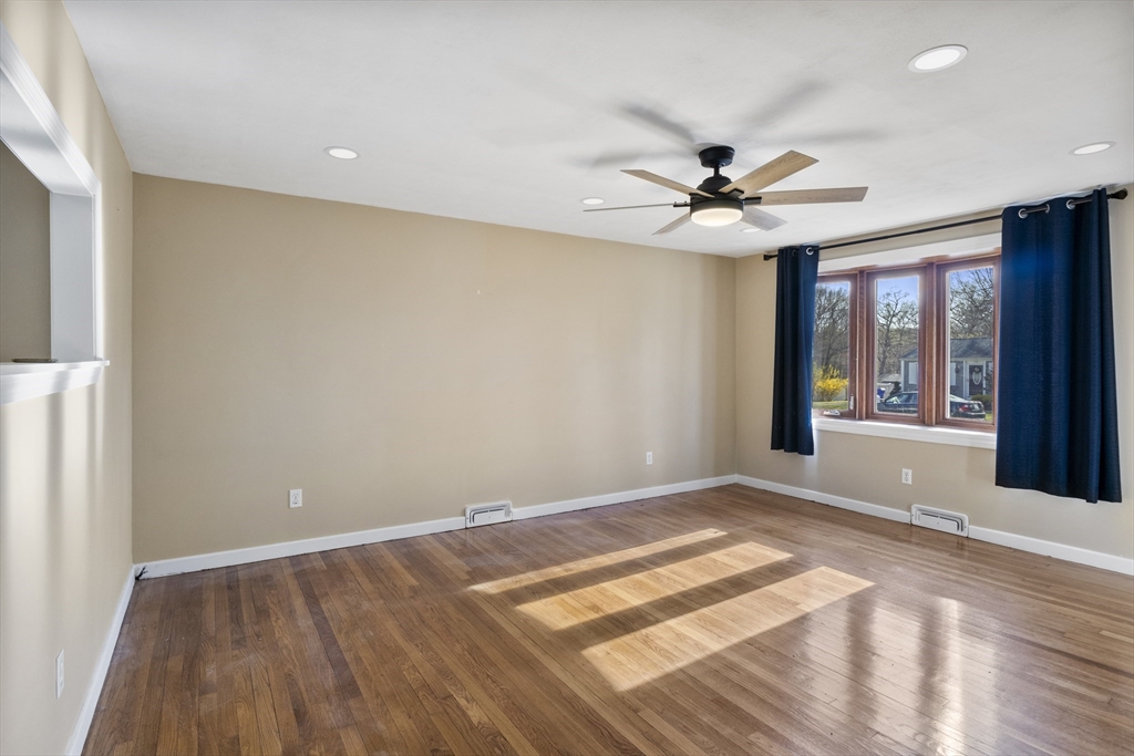 165 Sawmill Road Springfield, MA 01118 - Photo 18 of 39 a view of a livingroom with a chandelier fan and windows