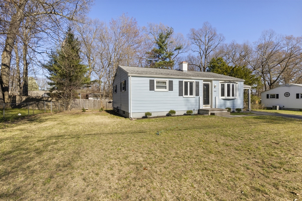 165 Sawmill Road Springfield, MA 01118 - Photo 2 of 39 a front view of house with yard and trees around