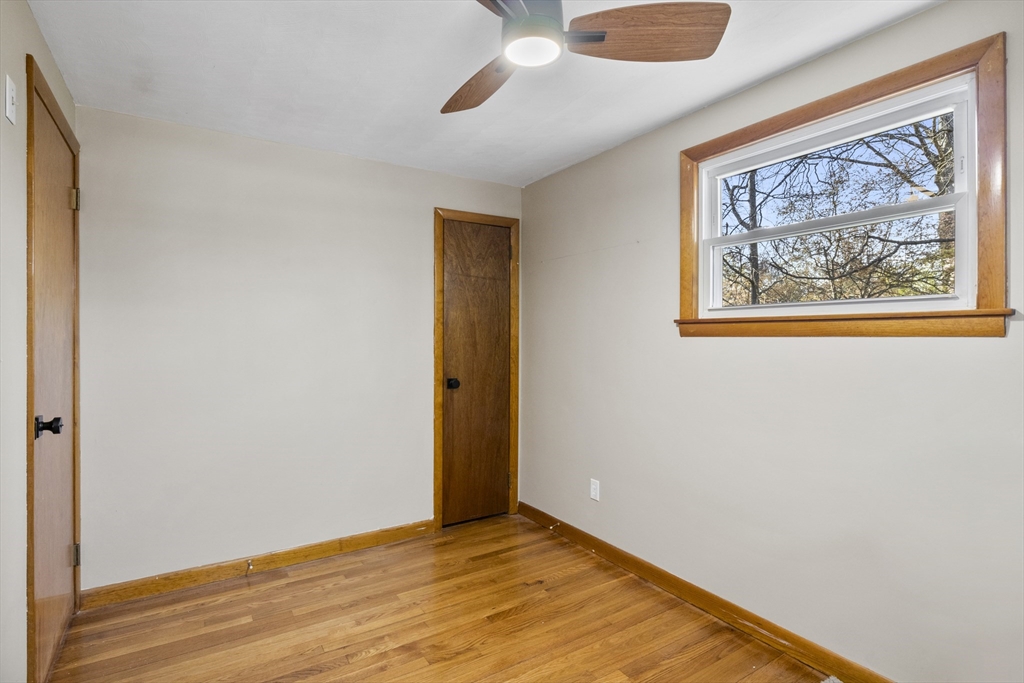 165 Sawmill Road Springfield, MA 01118 - Photo 29 of 39 a view of an empty room with wooden floor