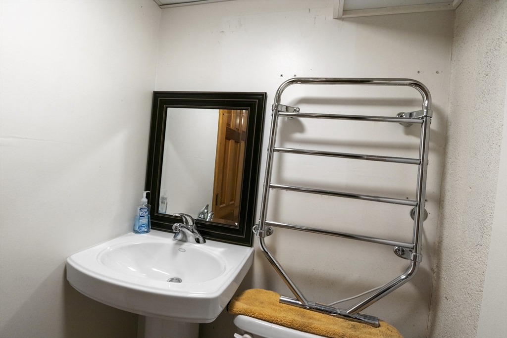165 Sawmill Road Springfield, MA 01118 - Photo 35 of 39 a bathroom with a sink and a mirror