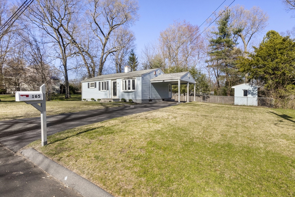165 Sawmill Road Springfield, MA 01118 - Photo 4 of 39 a front view of a house with large trees