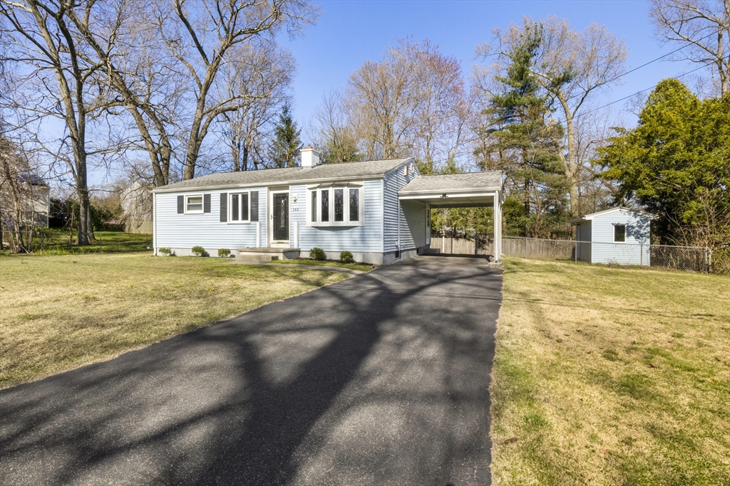 165 Sawmill Road Springfield, MA 01118 - Photo 5 of 39 a front view of a house with a yard