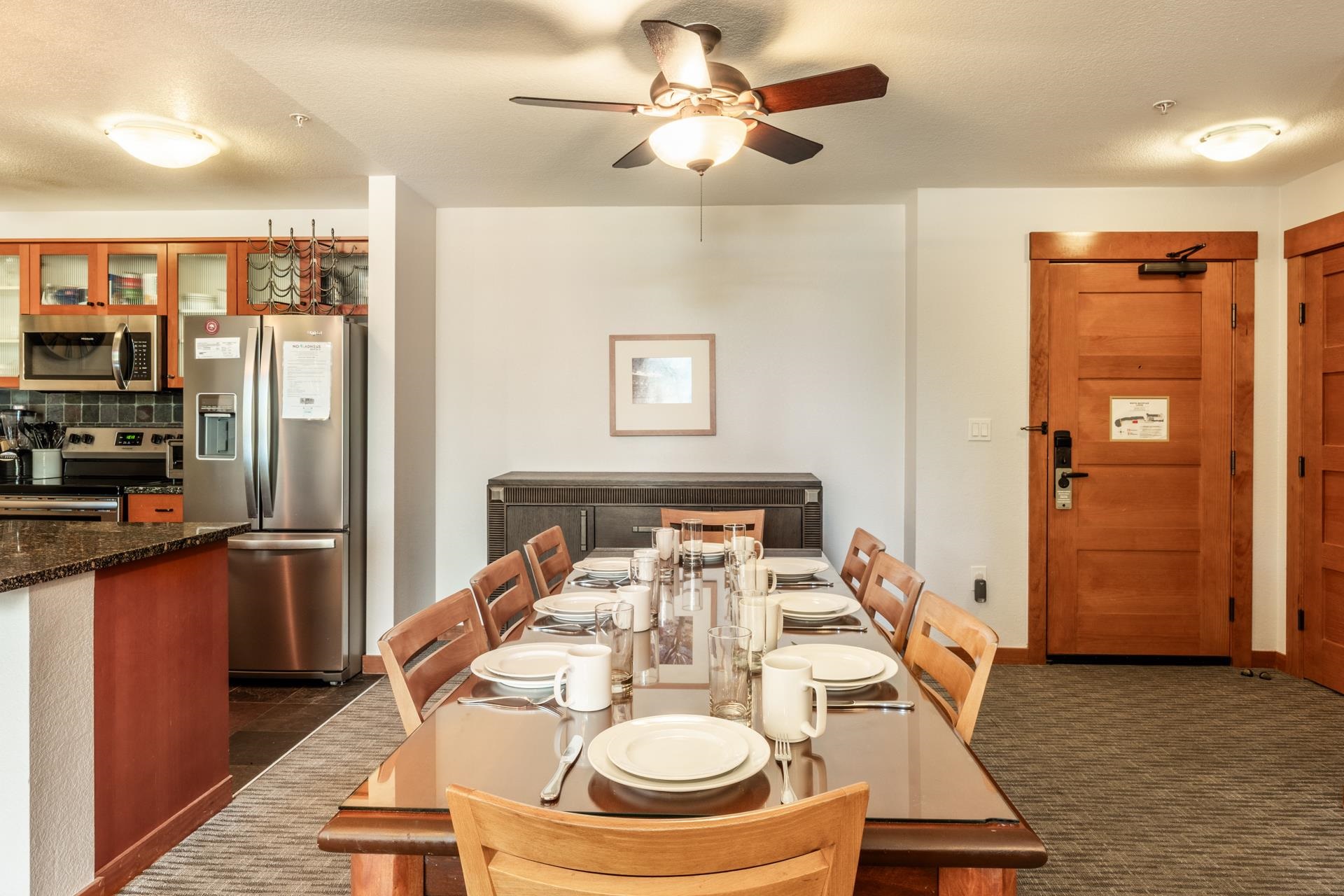 6201 Minaret Road, Unit 2117 Mammoth Lakes, CA 93546 - Photo 15 of 47 a dining room with furniture and a kitchen view