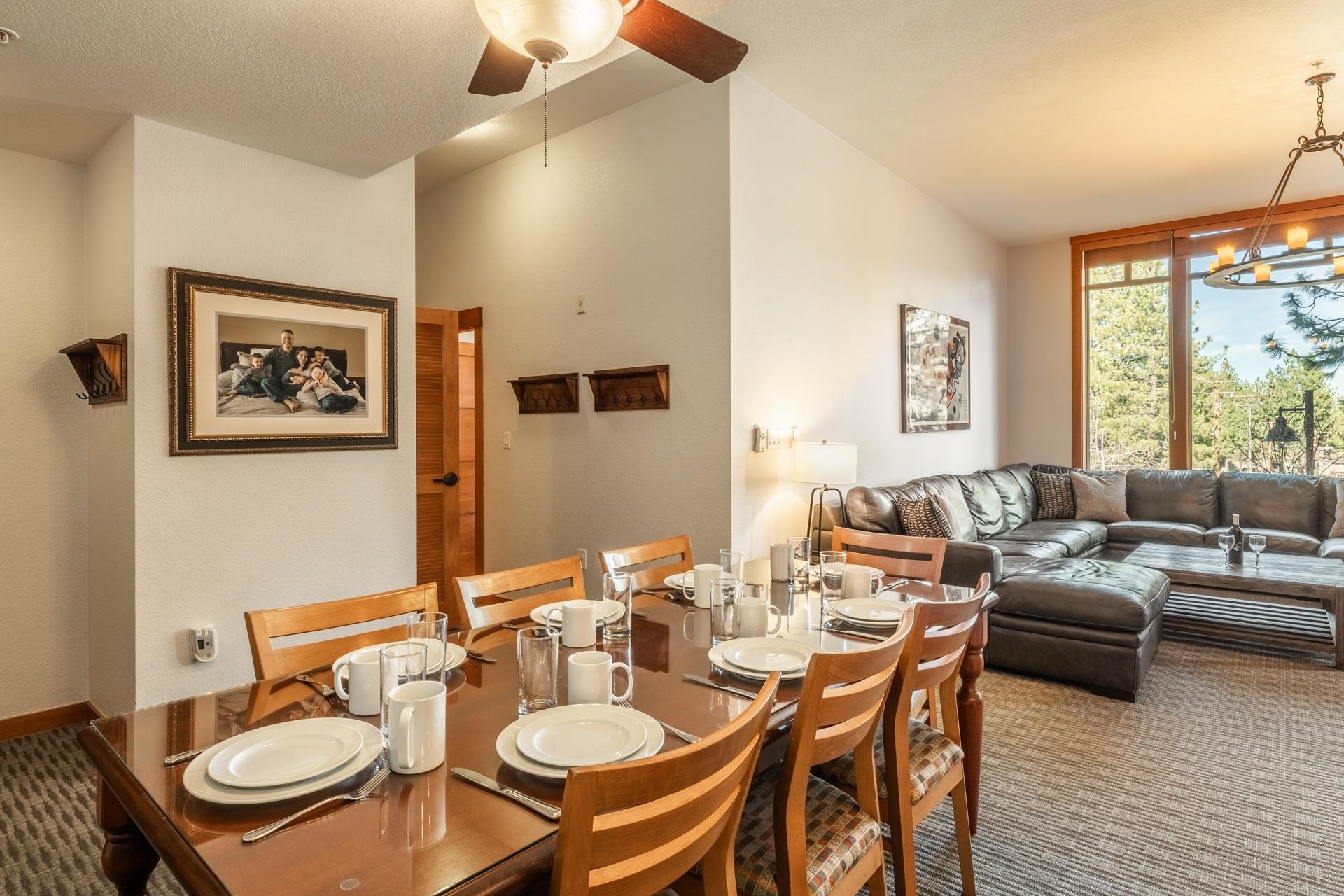 6201 Minaret Road, Unit 2117 Mammoth Lakes, CA 93546 - Photo 18 of 47 a dining room with furniture a large window and a table