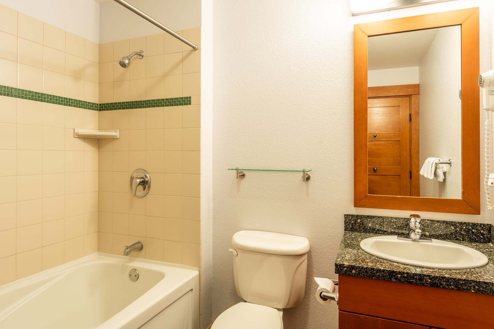 6201 Minaret Road, Unit 2117 Mammoth Lakes, CA 93546 - Photo 26 of 47 a bathroom with a granite countertop sink toilet and shower