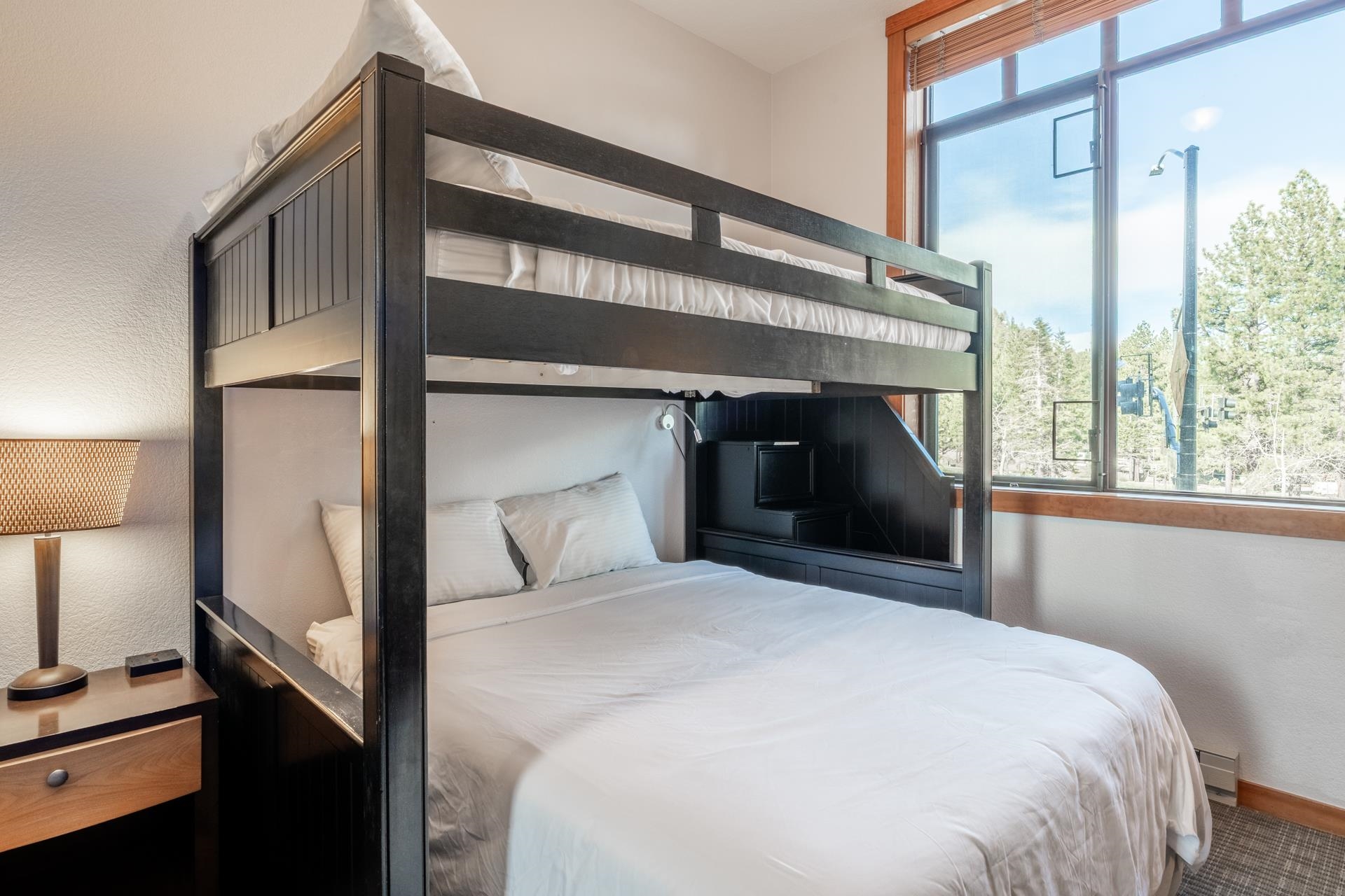 6201 Minaret Road, Unit 2117 Mammoth Lakes, CA 93546 - Photo 33 of 47 a bedroom with a bed and a lamp next to a window