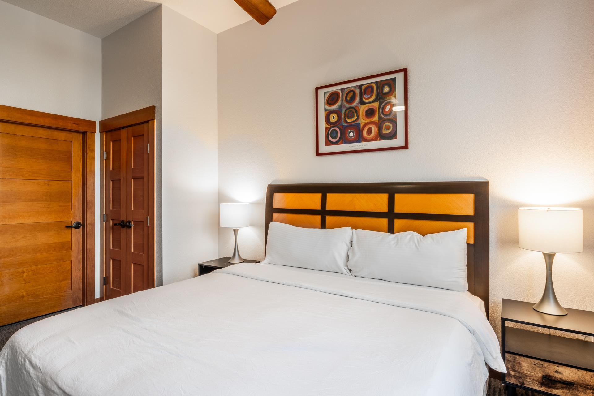 6201 Minaret Road, Unit 2117 Mammoth Lakes, CA 93546 - Photo 37 of 47 a bedroom with a bed and a lamp on table