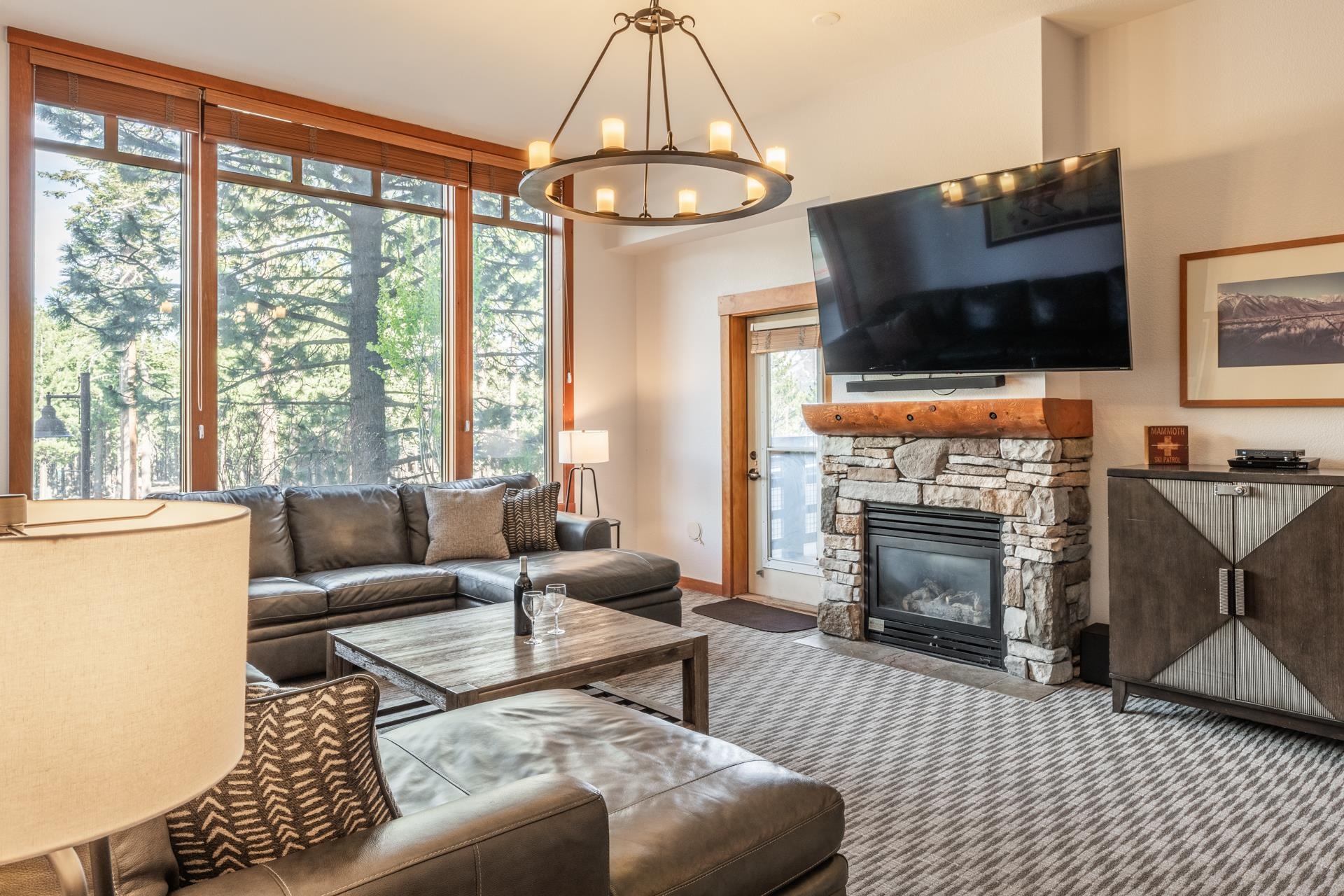 6201 Minaret Road, Unit 2117 Mammoth Lakes, CA 93546 - Photo 4 of 47 a living room with furniture a flat screen tv and a fireplace