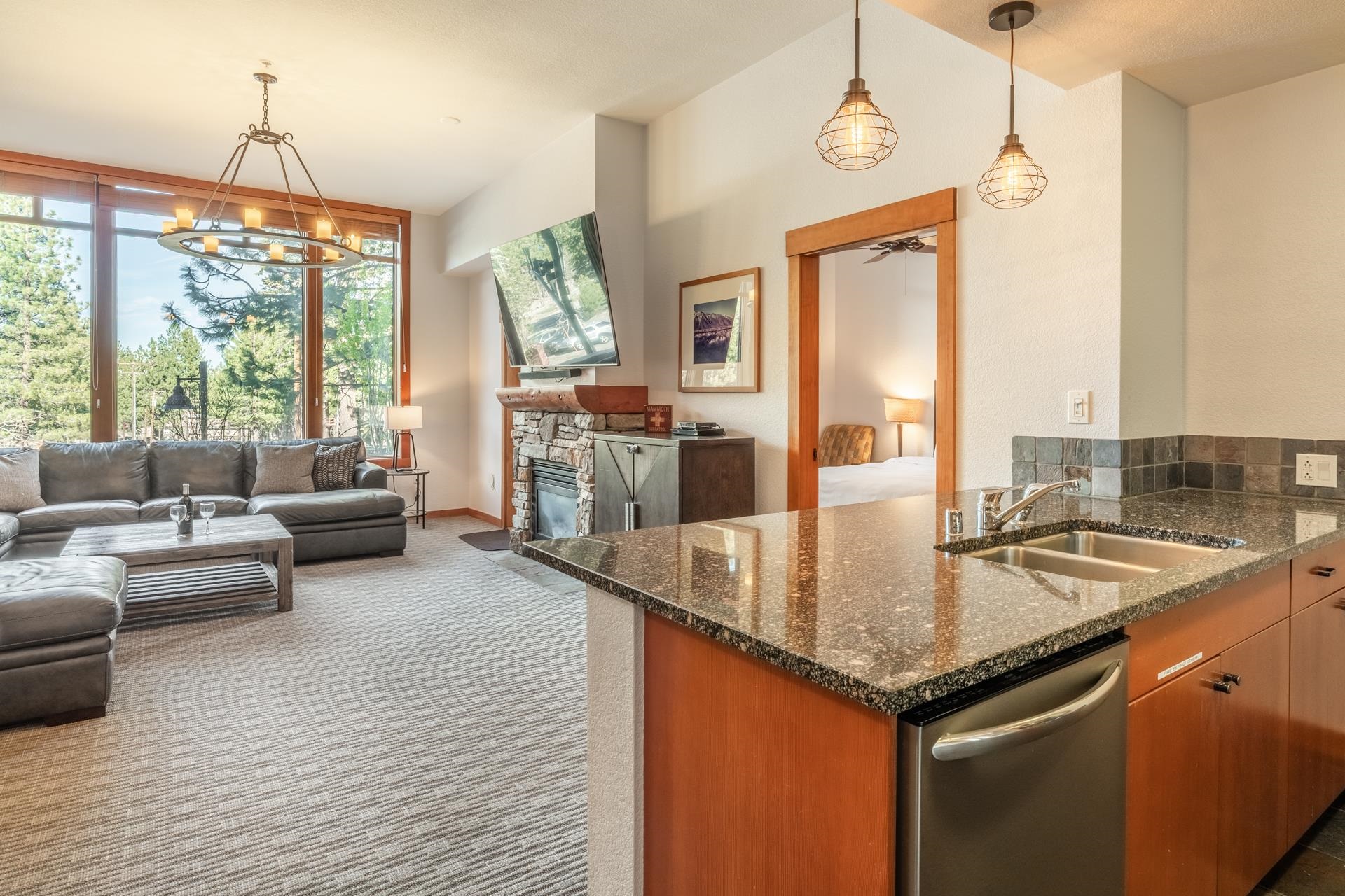 6201 Minaret Road, Unit 2117 Mammoth Lakes, CA 93546 - Photo 6 of 47 a kitchen with sink refrigerator and large window