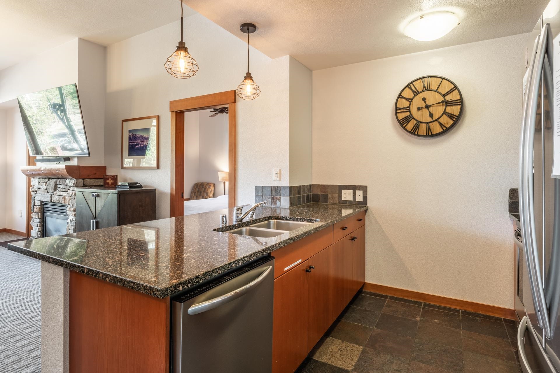 6201 Minaret Road, Unit 2117 Mammoth Lakes, CA 93546 - Photo 7 of 47 a kitchen with granite countertop a sink cabinets and window