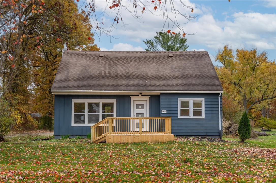 1931 Bridger Road Akron, OH 44312 - Photo 1 of 40 View of front facade with a deck and a front lawn