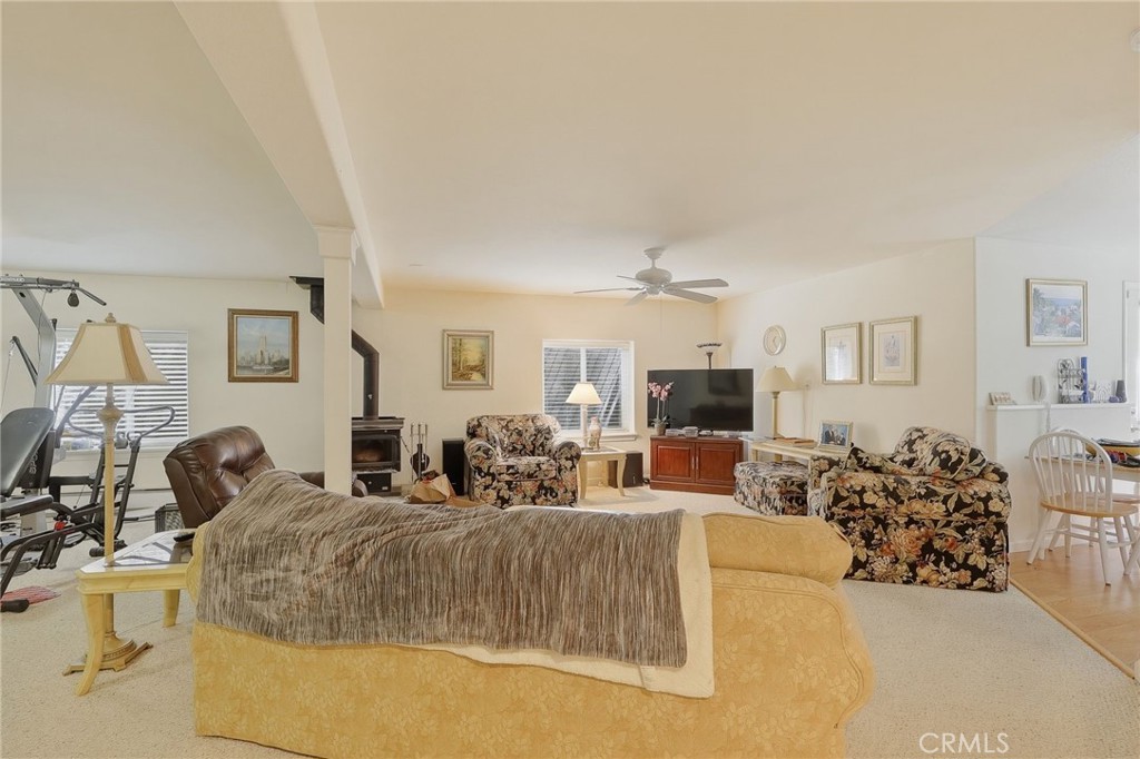 19370 Park Ridge Drive Hidden Valley Lake, CA 95467 - Photo 36 of 61 a living room with furniture and a flat screen tv
