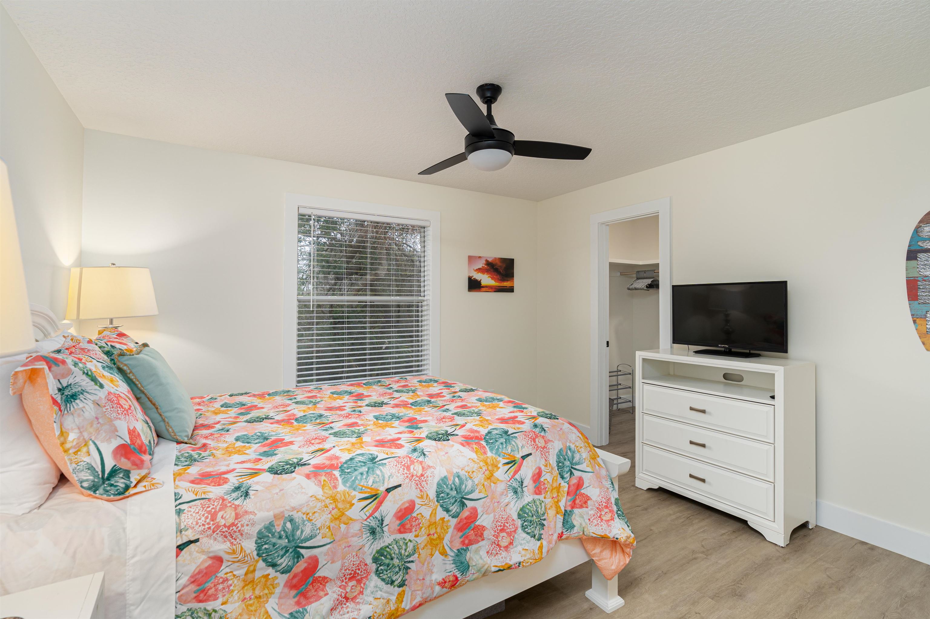 203 E Street, Unit C St. Augustine, FL 32080 - Photo 13 of 36 a bedroom with a bed and a flat screen tv