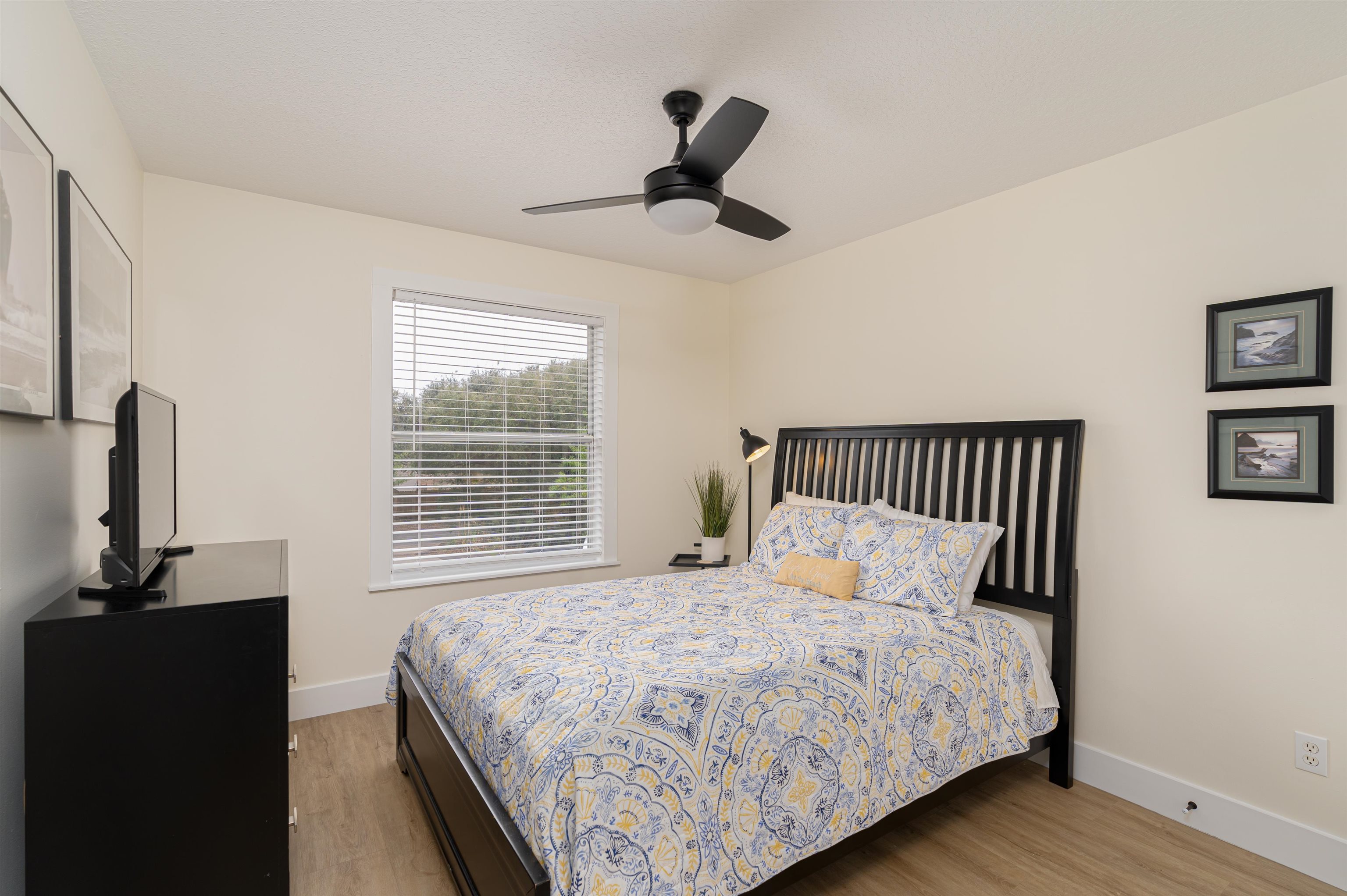 203 E Street, Unit C St. Augustine, FL 32080 - Photo 17 of 36 a bedroom with a bed and a window