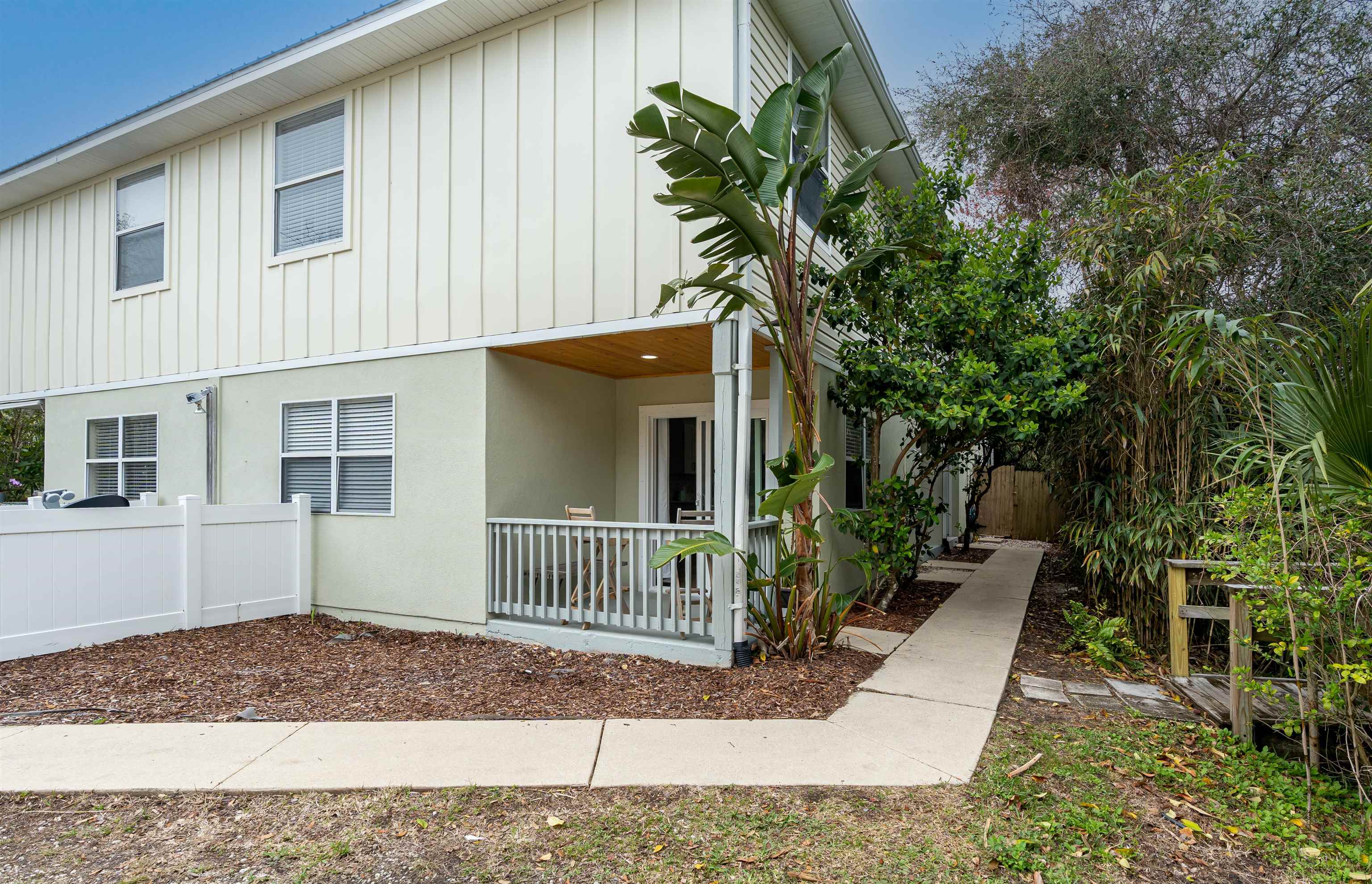 203 E Street, Unit C St. Augustine, FL 32080 - Photo 21 of 36 a view of a house with a yard and plants
