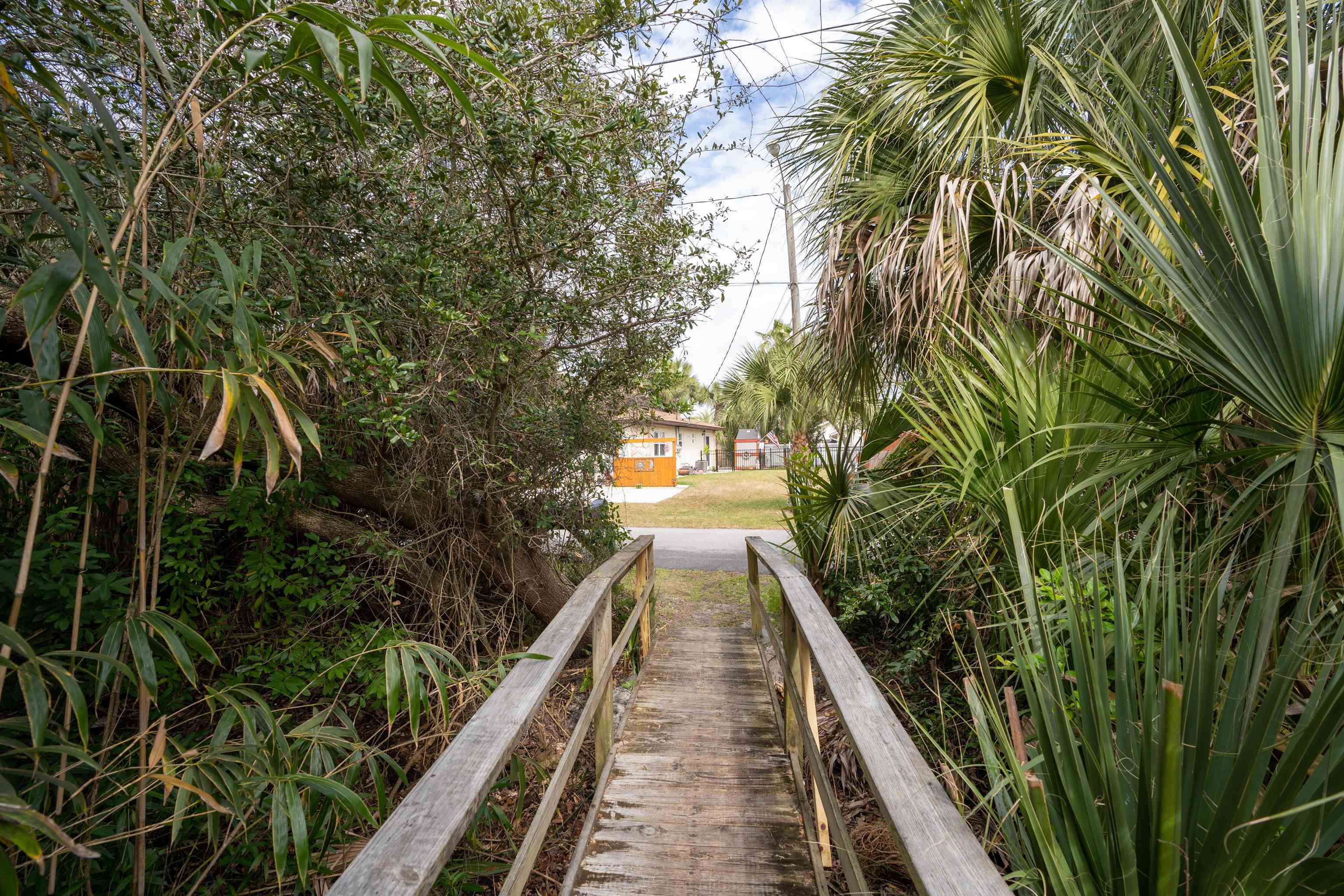 203 E Street, Unit C St. Augustine, FL 32080 - Photo 29 of 36 a view of a house with balcony and wooden floor