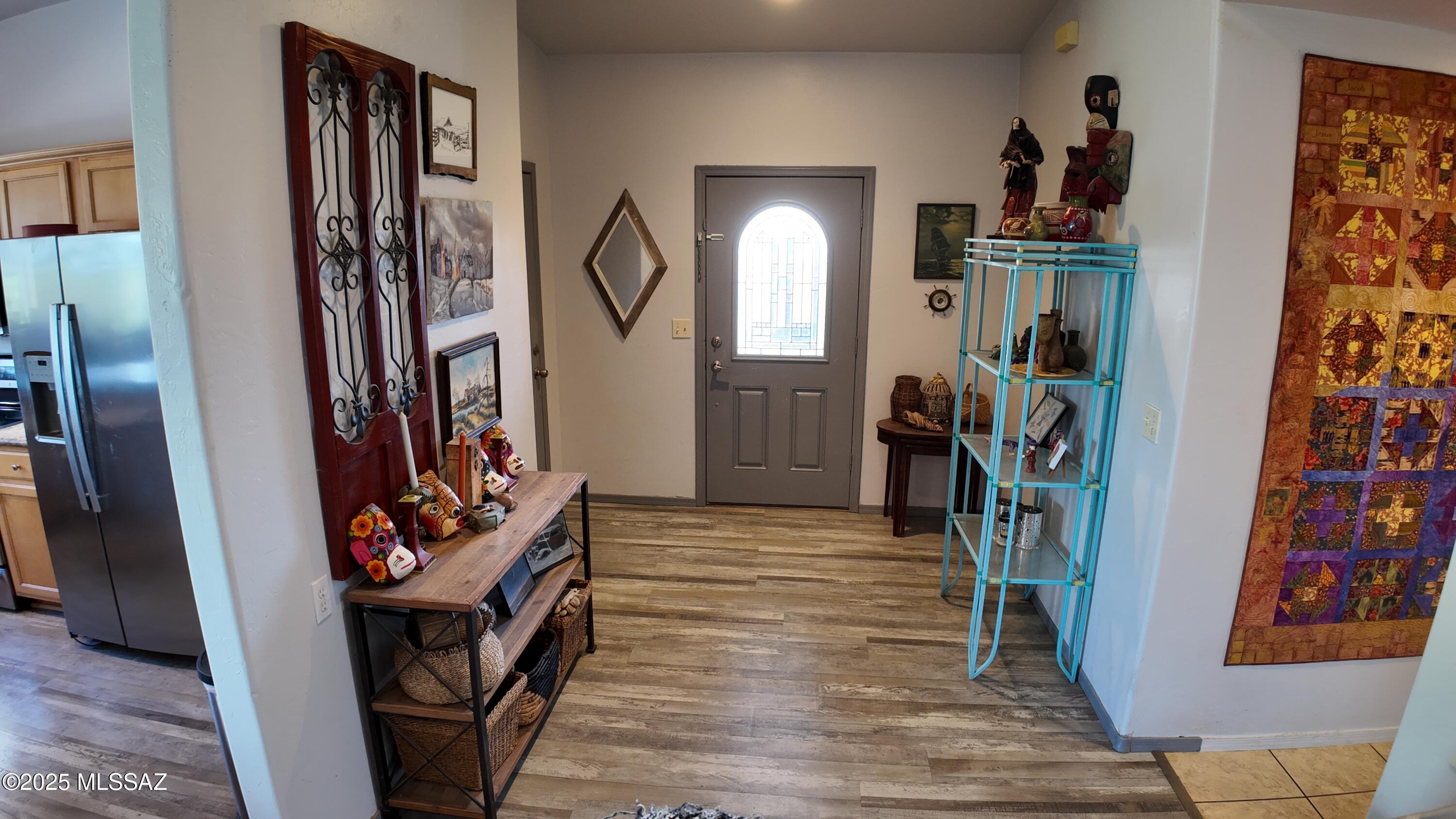 995 Jar Court Rio Rico, AZ 85648 - Photo 15 of 44 a view of an entryway with wooden floor