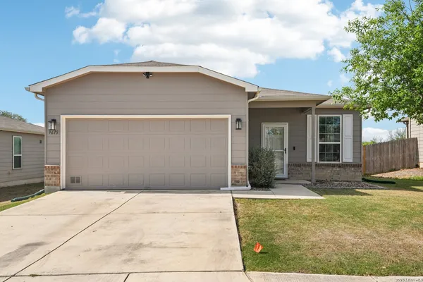 a house with yard in front of it