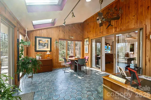 a view of a dining room with furniture window and outside view