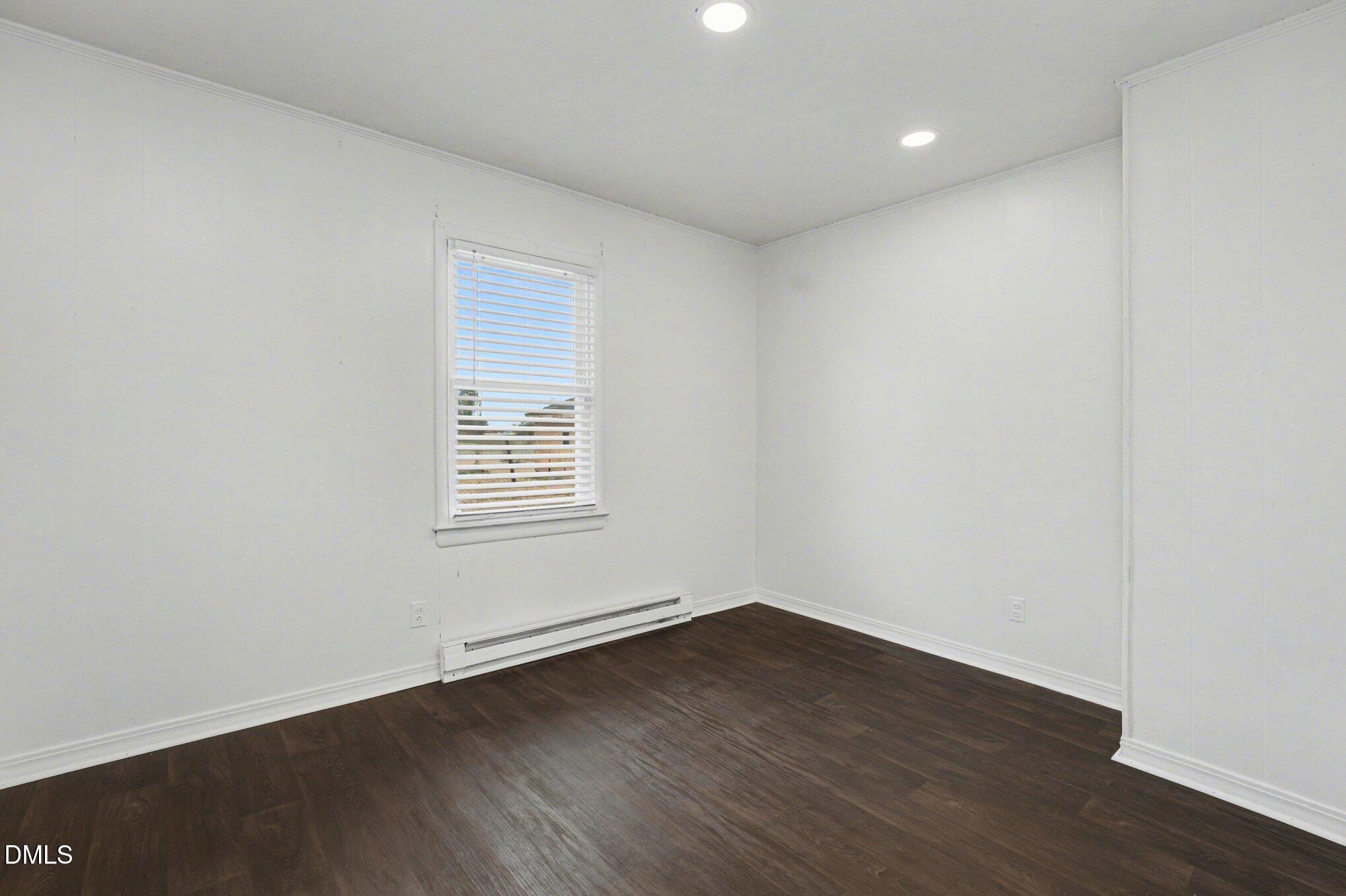 170 Flowers Road Mount Olive, NC 28365 - Photo 11 of 19 wooden floor in an empty room with a window
