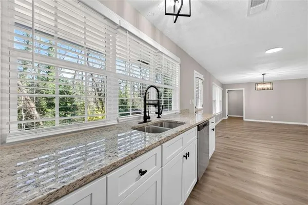a large kitchen with a large window