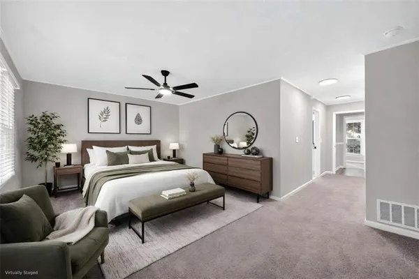 a bedroom with bed and window