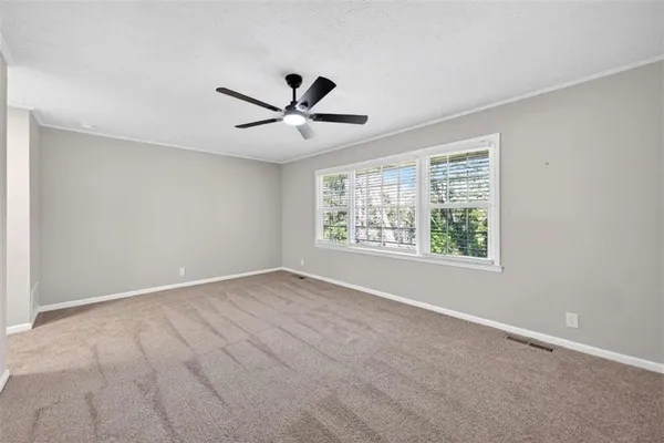 a view of an empty room with a window