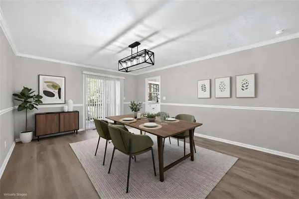 a view of a dining room with furniture window and wooden floor