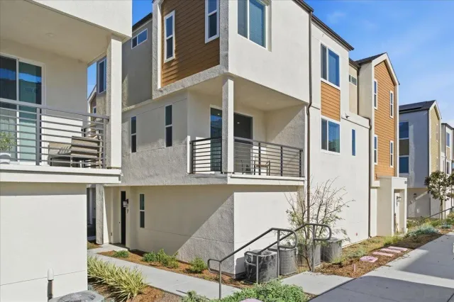 a front view of a building with many windows