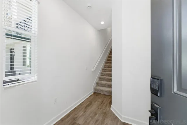 a view of entryway with wooden floor
