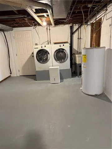 a white toilet sitting next to a shower