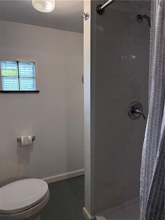 259 Rte 908 Natrona Heights, PA 15065 - Photo 24 of 29 a white toilet sitting next to a shower