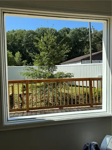 a view of balcony with floor to ceiling windows and outdoor view