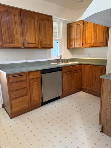 a kitchen with sink cabinets and window