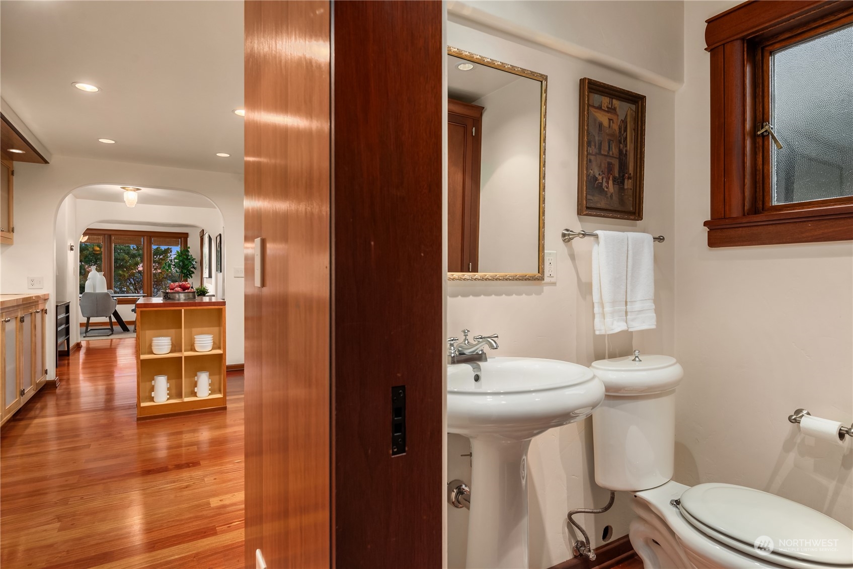 11287 Marine View Drive Southwest Seattle, WA 98146 - Photo 19 of 40 a bathroom with a sink toilet mirror and vanity
