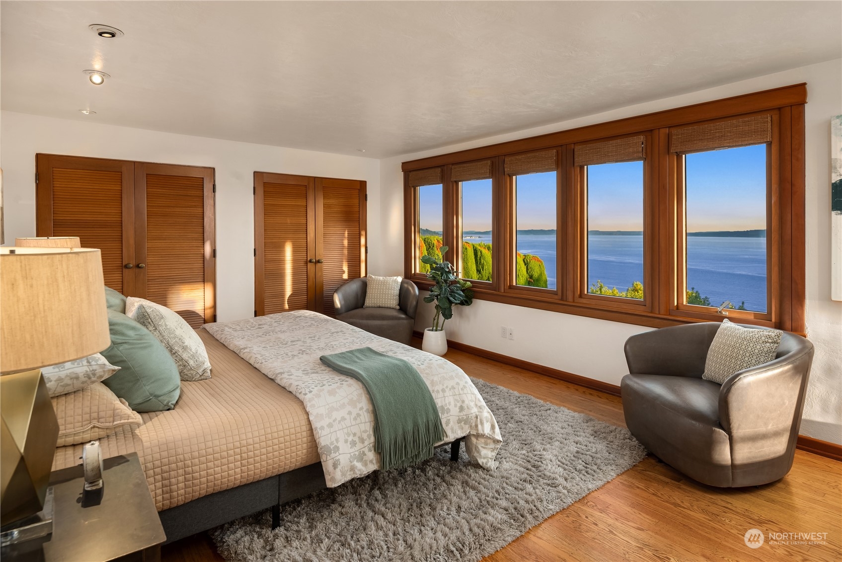 11287 Marine View Drive Southwest Seattle, WA 98146 - Photo 24 of 40 a bedroom with a bed and glass window