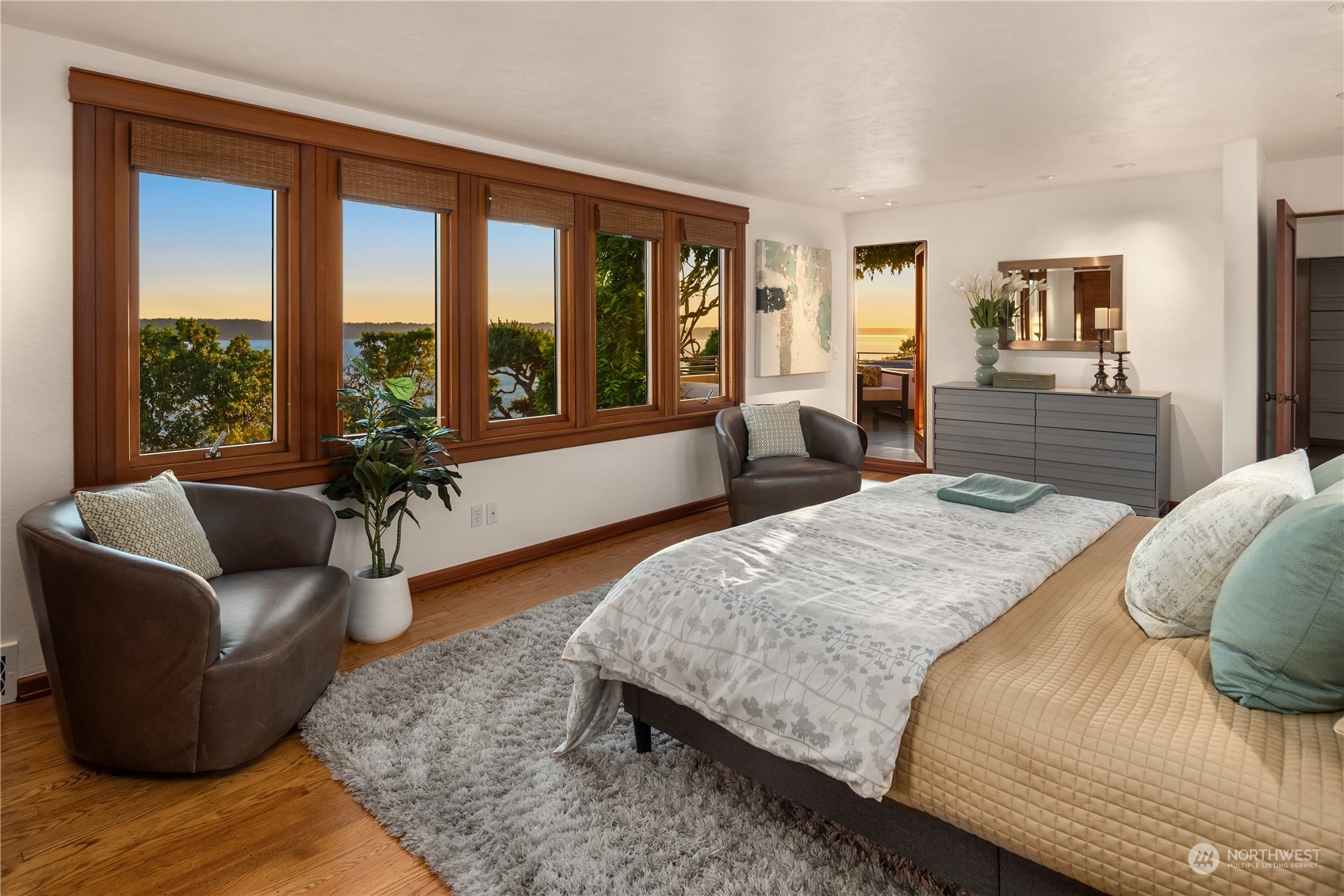 11287 Marine View Drive Southwest Seattle, WA 98146 - Photo 25 of 40 a bedroom with a large bed couch and a large window
