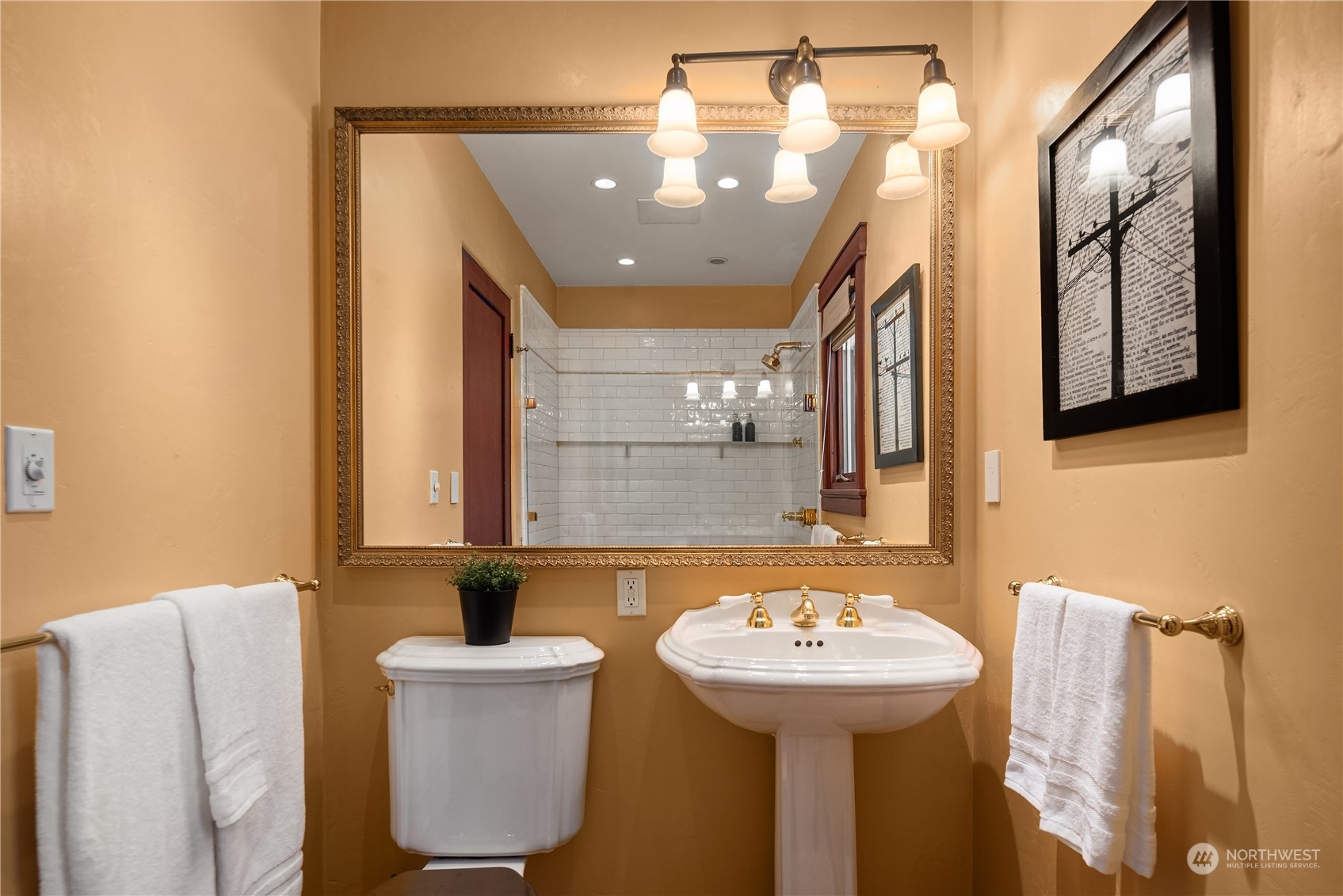 11287 Marine View Drive Southwest Seattle, WA 98146 - Photo 30 of 40 a bathroom with a sink and a mirror