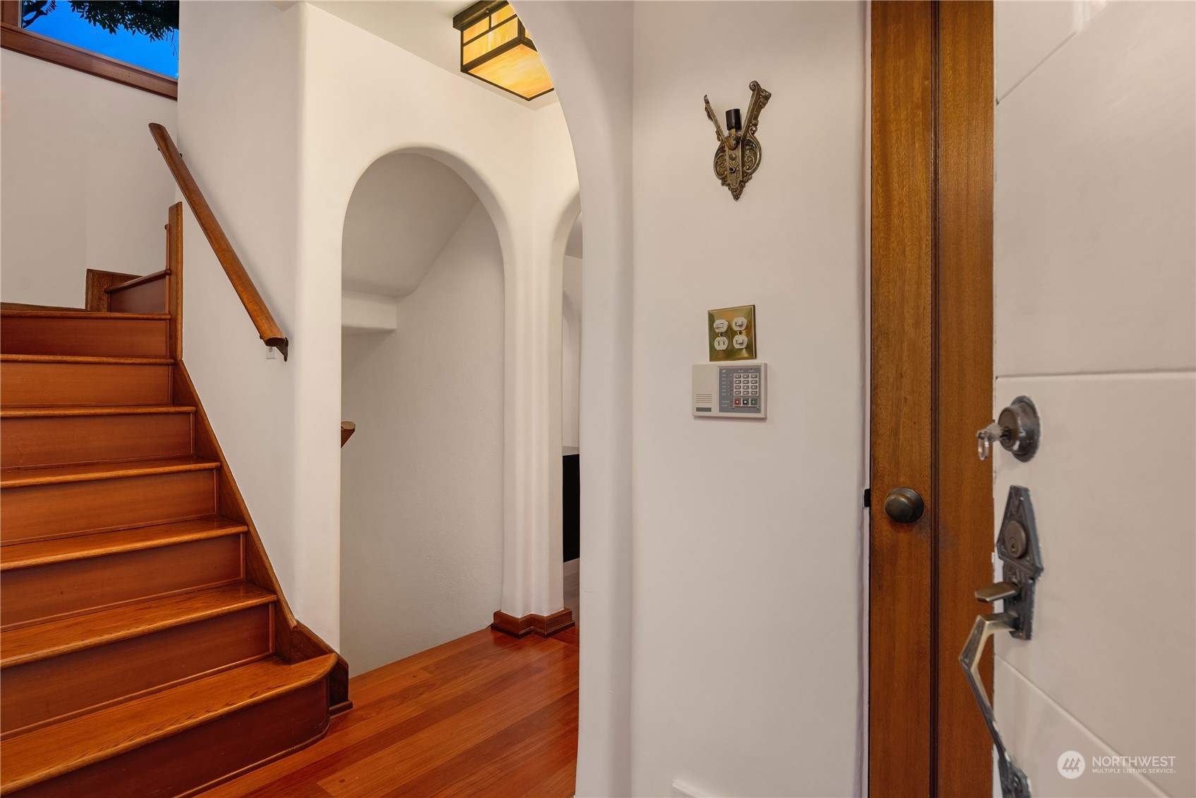 11287 Marine View Drive Southwest Seattle, WA 98146 - Photo 3 of 40 a view of a hallway with wooden floor and staircase