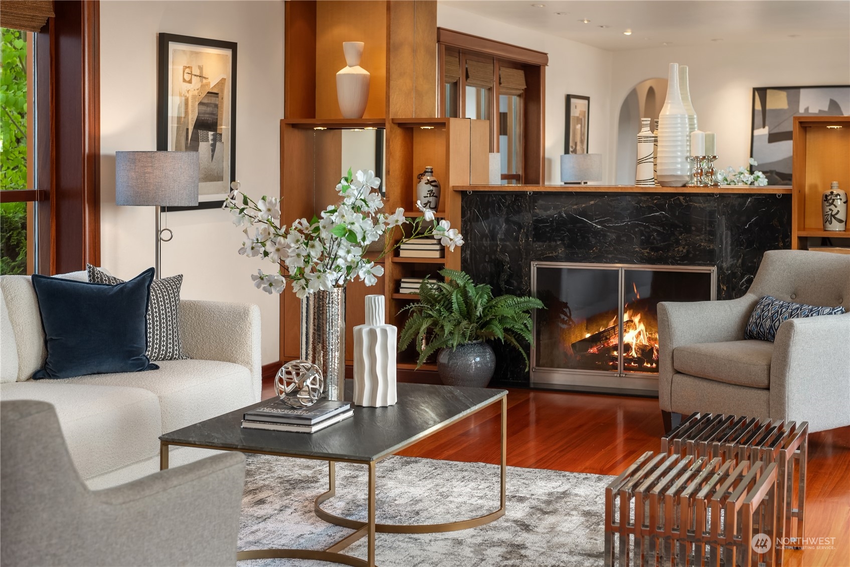 11287 Marine View Drive Southwest Seattle, WA 98146 - Photo 5 of 40 a living room with furniture potted plant and a fireplace