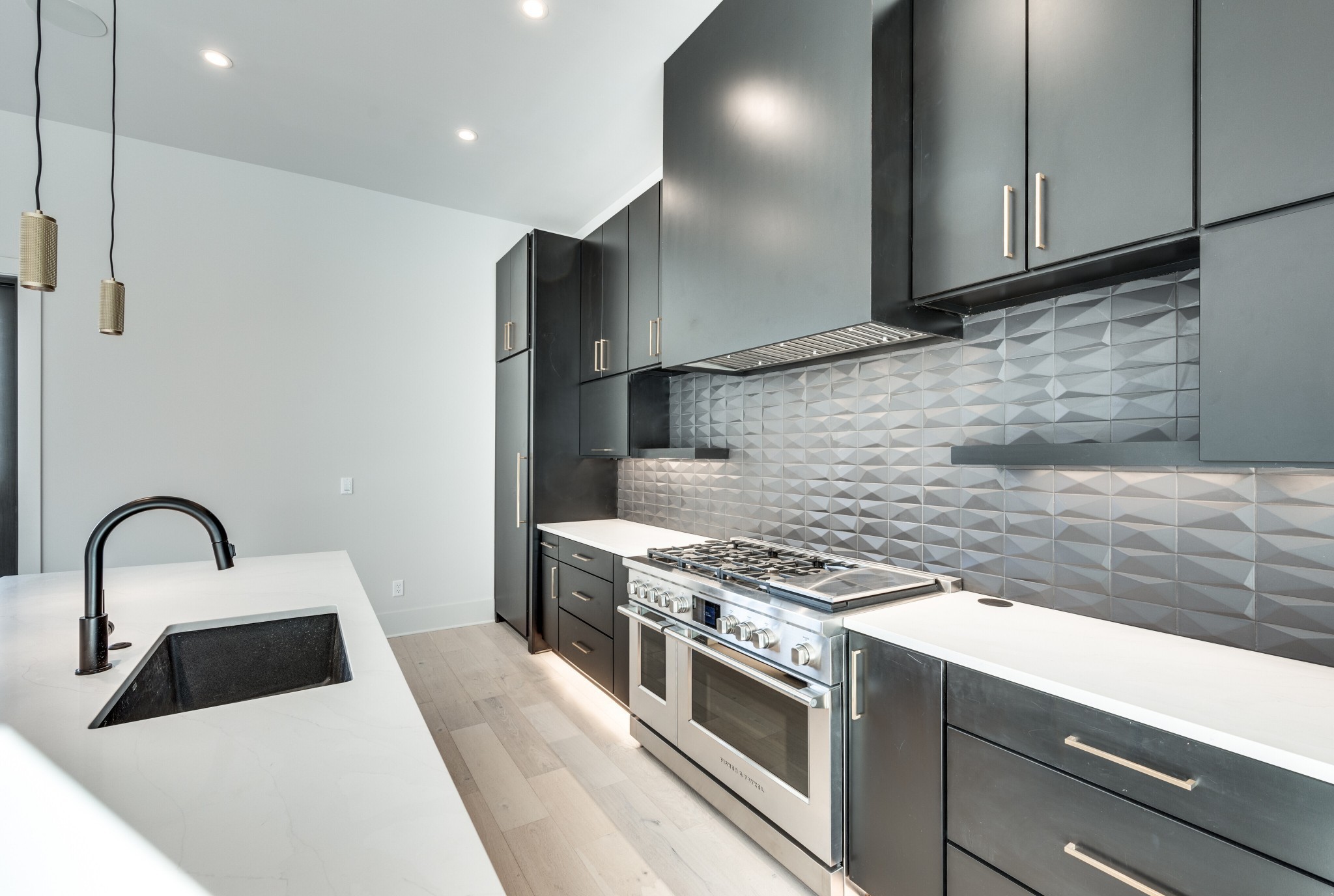 3122 A Belwood Street Nashville, TN 37203 - Photo 29 of 61 a kitchen with granite countertop a stove and a sink